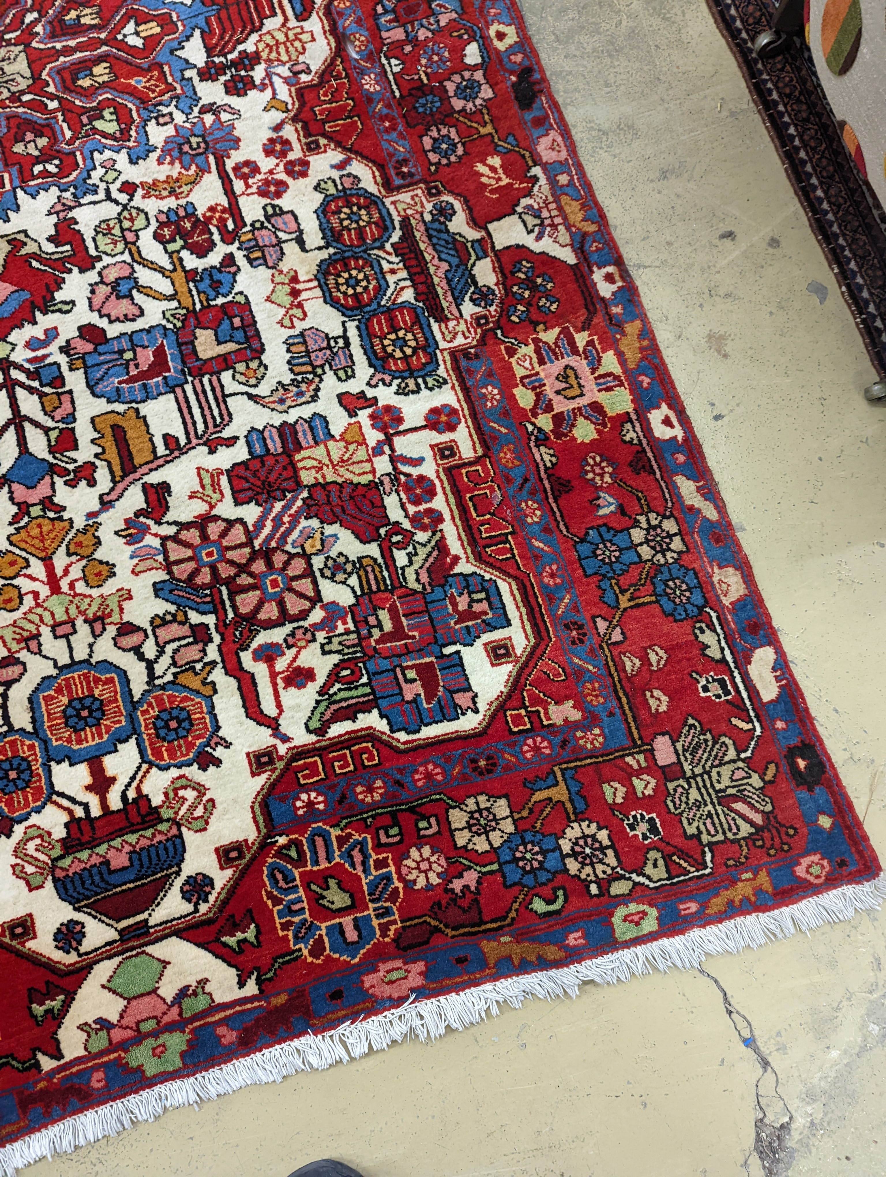 A Caucasian design ivory ground carpet, 260 x 158cm together with a smaller Tabriz style Tree of Life rug